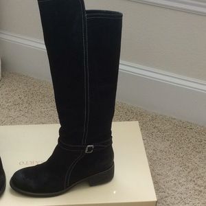 Black suede tall knee length boots.